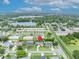 Overhead shot capturing a neighborhood with lush greenery and a tranquil lake, marked with a location pin at 3010 Brandywine Dr, Orlando, FL 32806