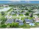 Scenic aerial view of homes with pools and solar panels, featuring a well-maintained community with green spaces at 3010 Brandywine Dr, Orlando, FL 32806