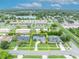 Aerial view of a lovely home with well-kept lawn and mature trees, with property lines outlined in yellow at 3010 Brandywine Dr, Orlando, FL 32806