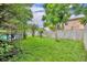 Expansive backyard with vibrant greenery, mature trees, and ample space for outdoor enjoyment at 3010 Brandywine Dr, Orlando, FL 32806