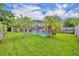 Beautiful backyard showcasing a screened-in pool and lush landscaping, creating a private oasis at 3010 Brandywine Dr, Orlando, FL 32806