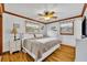 Well-lit bedroom with wood floor, white trim, white walls, ceiling fan and traditional-style furniture at 3010 Brandywine Dr, Orlando, FL 32806