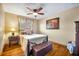 Cozy bedroom with wood floors, natural lighting, and neutral color scheme and traditional-style furnishings at 3010 Brandywine Dr, Orlando, FL 32806