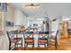 Kitchen island with seating, stainless steel appliances, white cabinets, and open layout to a living area at 3010 Brandywine Dr, Orlando, FL 32806