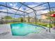 Relaxing screened-in pool with clear blue water and poolside seating, nestled in a private backyard setting at 3010 Brandywine Dr, Orlando, FL 32806