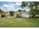 Spacious backyard with patio, lush greenery and lawn, perfect for outdoor activities and relaxation at 311 Cortland Ave, Winter Park, FL 32789