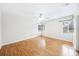 A sunlit bedroom with hardwood floors and two windows at 311 Cortland Ave, Winter Park, FL 32789