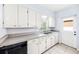 Bright kitchen with white cabinets and a stainless steel sink at 311 Cortland Ave, Winter Park, FL 32789