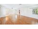 Bright living room with wood flooring, white walls, and natural light at 311 Cortland Ave, Winter Park, FL 32789