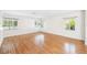 Bright living room with wood flooring, white walls, and natural lighting at 311 Cortland Ave, Winter Park, FL 32789