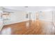 Open-concept living room with hardwood floors, white walls, and natural light at 311 Cortland Ave, Winter Park, FL 32789