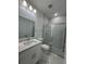 This bathroom features a glass-enclosed shower and modern vanity at 320 W Necho Ave, Lake Alfred, FL 33850
