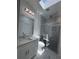 This gorgeous bathroom offers elegant marble floors and a glass enclosed shower with a stunning skylight overhead at 320 W Necho Ave, Lake Alfred, FL 33850