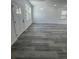 An entryway featuring stylish gray wood-look flooring and light, neutral walls at 320 W Necho Ave, Lake Alfred, FL 33850