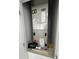 View of the Carrier brand furnace in a closet at 320 W Necho Ave, Lake Alfred, FL 33850