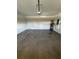 Spacious two car garage with epoxy floor, water heater, and garage door opener at 320 W Necho Ave, Lake Alfred, FL 33850