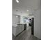 Open kitchen featuring stainless steel appliances and a center island at 320 W Necho Ave, Lake Alfred, FL 33850