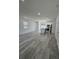 Spacious living area with kitchen island, modern appliances, and pendant lights at 320 W Necho Ave, Lake Alfred, FL 33850