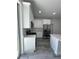 Modern kitchen featuring stainless steel appliances and sleek countertops at 320 W Necho Ave, Lake Alfred, FL 33850
