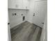 The laundry room features modern hookups and extra storage space at 320 W Necho Ave, Lake Alfred, FL 33850