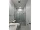 Bathroom featuring marble-look tile in glass enclosed shower at 320 W Necho Ave, Lake Alfred, FL 33850