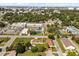 An aerial view shows the neighborhood including nearby school, park and community swimming pool at 338 Henry Butts Dr, Daytona Beach, FL 32114