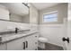 Well-lit bathroom features granite counters, a vanity with storage, and tiled walls at 338 Henry Butts Dr, Daytona Beach, FL 32114