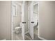 Bathroom with toilet and doorway to bedroom with an ensuite bathroom and closet at 338 Henry Butts Dr, Daytona Beach, FL 32114