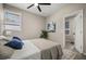 Cozy bedroom features a comfortable bed, stylish decor, and an ensuite bathroom at 338 Henry Butts Dr, Daytona Beach, FL 32114