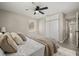 Bright bedroom featuring wood-look floors, a ceiling fan, and a closet at 338 Henry Butts Dr, Daytona Beach, FL 32114