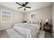 Cozy bedroom with neutral tones, wood-look floors, and natural lighting at 338 Henry Butts Dr, Daytona Beach, FL 32114