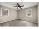 Vacant bedroom with two windows, modern ceiling fan, and neutral paint at 338 Henry Butts Dr, Daytona Beach, FL 32114