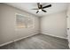 Vacant bedroom with large window, modern ceiling fan, and neutral paint at 338 Henry Butts Dr, Daytona Beach, FL 32114