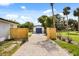 A gated driveway leads to a detached garage, ensuring privacy at 338 Henry Butts Dr, Daytona Beach, FL 32114