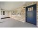 Charming entryway with a stone facade and a vibrant blue front door at 338 Henry Butts Dr, Daytona Beach, FL 32114