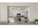 Open kitchen featuring granite countertops, stainless appliances, and pass-through to living area at 338 Henry Butts Dr, Daytona Beach, FL 32114
