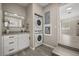 Laundry area with stacked washer and dryer, updated vanity, and ample storage at 338 Henry Butts Dr, Daytona Beach, FL 32114
