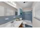 This bathroom has blue tile with a shower and nice sink at 3430 Arbutus Ln, Winter Park, FL 32792