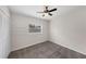 This bedroom features neutral walls and a ceiling fan at 3430 Arbutus Ln, Winter Park, FL 32792