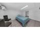 This simple bedroom features a bed and tiled floors at 3430 Arbutus Ln, Winter Park, FL 32792