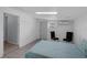 This simple bedroom features a bed and tiled floors at 3430 Arbutus Ln, Winter Park, FL 32792