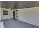 Covered front porch with gray flooring, offering a welcoming entrance to the home at 3430 Arbutus Ln, Winter Park, FL 32792