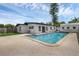 A view of the pool highlighting the easy access to the home and the surrounding backyard space at 3430 Arbutus Ln, Winter Park, FL 32792