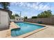 An inviting backyard pool with a white pool house, perfect for relaxing and enjoying the outdoors at 3430 Arbutus Ln, Winter Park, FL 32792