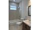 Modern bathroom featuring a tub, shower, toilet, and vanity with a sink at 3431 Orchid Dr, Indian Lake Estates, FL 33855