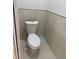 A functional half bathroom features a modern toilet at 3431 Orchid Dr, Indian Lake Estates, FL 33855