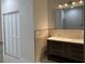 Bathroom featuring double vanity, modern fixtures, and ample storage space at 3431 Orchid Dr, Indian Lake Estates, FL 33855