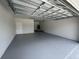 Spacious two car garage with door to the house at 3431 Orchid Dr, Indian Lake Estates, FL 33855