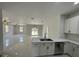 Bright kitchen featuring stainless steel appliances with views of the living room at 3431 Orchid Dr, Indian Lake Estates, FL 33855