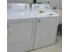 Bright laundry room with modern washer and dryer, plus a utility sink at 3431 Orchid Dr, Indian Lake Estates, FL 33855